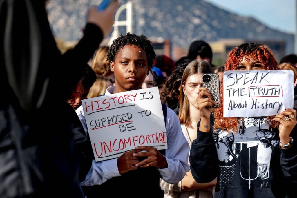 Temecula, CA - December 16: Great Oak High School students hold signs during a protest of the districts ban of critical race theory curriculum at Patricia H. Birdsall Sports Park in Temecula on Friday, Dec. 16, 2022. (Photo by Watchara Phomicinda/The Press-Enterprise via Getty Images)