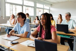 students sitting in a classroom learning